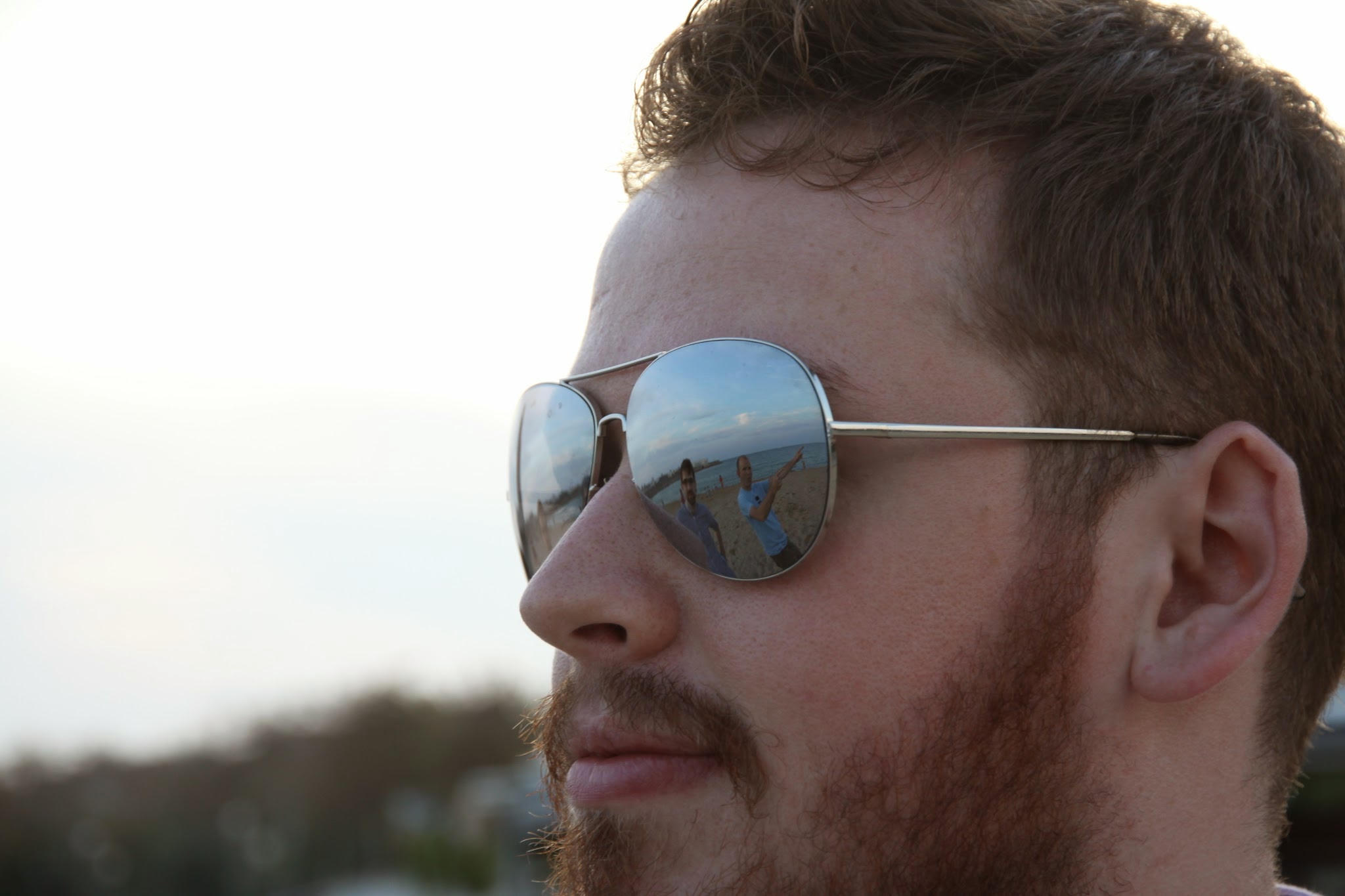 Portrait of Euan Reid wearing aviator sunglasses